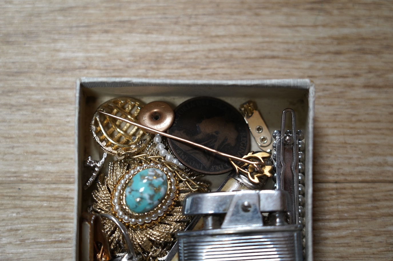 Assorted jewellery and other items including a 1970's 9ct gold Cavalier charm, 30mm, 5.9 grams, a 14k tram charm, 1.7 grams, a 9ct and enamel Esso badge, a yellow metal stick pin, marcasite and costume, lighter penknife,